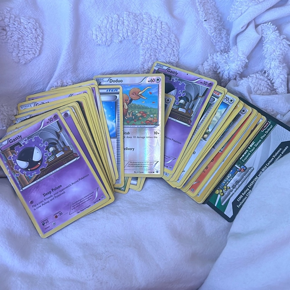 36 Pokémon card bundle with common,uncommon, and rare cards as well as energy.